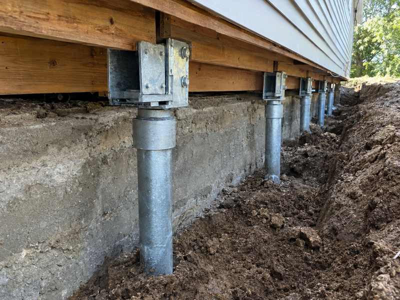 Foundation repair with steel piers under a Greenville, SC home